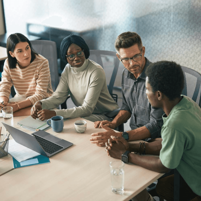 Black professional team in a conference setting